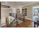 Spacious foyer with hardwood floors, elegant staircase, and upper level gallery at 3042 Kings Manor Dr, Weddington, NC 28104