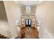 A grand foyer with soaring ceilings, hardwood floors, and a stunning chandelier at 3042 Kings Manor Dr, Weddington, NC 28104