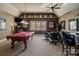 Spacious game room with a billiard table, poker table, and sports memorabilia on display at 3042 Kings Manor Dr, Weddington, NC 28104