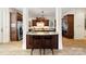 Charming kitchen with a breakfast bar separating two spaces and stainless steel appliances at 3042 Kings Manor Dr, Weddington, NC 28104