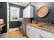 Laundry room features marble counters, white cabinets, and stainless steel washer and dryer at 3042 Kings Manor Dr, Weddington, NC 28104