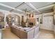 Living room features a stone fireplace, custom built-ins, coffered ceilings and a comfortable sectional sofa at 3042 Kings Manor Dr, Weddington, NC 28104