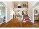 Open floor plan with view of the living room, staircase and second floor balcony at 3042 Kings Manor Dr, Weddington, NC 28104