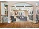 Bright living room featuring coffered ceilings, a fireplace, and a large gray sectional sofa with neutral decor at 3042 Kings Manor Dr, Weddington, NC 28104