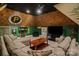 Relaxing living room designed with sports fans in mind and boasting a large sectional couch at 3042 Kings Manor Dr, Weddington, NC 28104