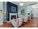 Living room with fireplace, comfortable seating, and hardwood floors at 397 Flat Rock Dr, Denver, NC 28037