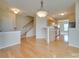 Open dining area with hardwood floors and kitchen access at 4906 Sunburst Ln, Charlotte, NC 28213