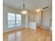 Dining area near entryway with hardwood floor and window at 4906 Sunburst Ln, Charlotte, NC 28213