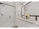 Modern bathroom with double vanity, marble shower, and large mirror at 5240 Carden Dr, Charlotte, NC 28227