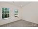 Spacious bedroom with large windows and neutral carpeting at 5240 Carden Dr, Charlotte, NC 28227