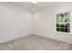 Simple bedroom with window and neutral wall color at 5240 Carden Dr, Charlotte, NC 28227