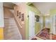 Entryway with staircase, light green walls, and patterned rug at 5927 Pisgah Way, Charlotte, NC 28217