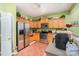 Kitchen with wood cabinets, stainless steel appliances, and green walls at 5927 Pisgah Way, Charlotte, NC 28217