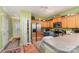 Kitchen with wood cabinets, stainless steel appliances, and green walls at 5927 Pisgah Way, Charlotte, NC 28217