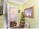Small powder room with green walls and framed artwork at 5927 Pisgah Way, Charlotte, NC 28217