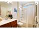 Simple bathroom with a tub shower combo and wood vanity at 7252 Shenandoah Dr, Fort Mill, SC 29707