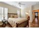 Bright bedroom with wood floors and a view of a small bathroom at 7252 Shenandoah Dr, Fort Mill, SC 29707