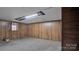 Unfinished basement room with wood paneling and window at 1056 Jolly Cemetery Rd, Taylorsville, NC 28681