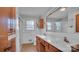 Bathroom boasts double sinks, wood cabinets, and a shower at 1056 Jolly Cemetery Rd, Taylorsville, NC 28681