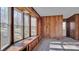 Bright living room featuring a large bay window and wood paneling at 1056 Jolly Cemetery Rd, Taylorsville, NC 28681