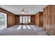 Spacious living room with built-in shelving and wood paneling at 1056 Jolly Cemetery Rd, Taylorsville, NC 28681