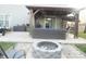 Backyard featuring an outdoor living area with a covered patio and fire pit at 11677 Striker Ln, Midland, NC 28107