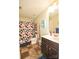 Cozy bathroom featuring a shower-tub combo and modern vanity at 11677 Striker Ln, Midland, NC 28107