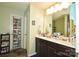 Double vanity bathroom with a large mirror and plenty of storage at 11677 Striker Ln, Midland, NC 28107
