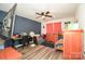 This bedroom features an accent wall, wood-look flooring, and ample natural light at 11677 Striker Ln, Midland, NC 28107
