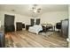 Primary bedroom with ceiling fan, vaulted ceiling, and a walk-in closet at 11677 Striker Ln, Midland, NC 28107
