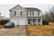 Two-story house with a two-car garage and a landscaped yard at 11677 Striker Ln, Midland, NC 28107