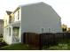 Side view of a two-story home with a fenced yard at 11677 Striker Ln, Midland, NC 28107