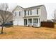 Two-story house with a two-car garage and a landscaped yard at 11677 Striker Ln, Midland, NC 28107