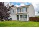 Charming two-story home featuring a welcoming front porch, a two-car garage, and a well-maintained front yard at 11677 Striker Ln, Midland, NC 28107