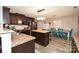 Modern kitchen features stainless steel appliances, a central island, and an adjacent dining area at 11677 Striker Ln, Midland, NC 28107