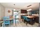 Open kitchen with a dining area, a large island, and wood-look flooring at 11677 Striker Ln, Midland, NC 28107