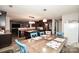 Kitchen and dining area featuring stainless steel appliances and a spacious breakfast bar at 11677 Striker Ln, Midland, NC 28107