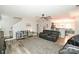 Open living room with stairs and kitchen view at 11677 Striker Ln, Midland, NC 28107