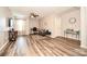 Well-lit living room with sleek floors, ceiling fan, and flexible space for work or relaxation at 11677 Striker Ln, Midland, NC 28107