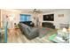 Living room boasts gray sectional and large TV at 11677 Striker Ln, Midland, NC 28107