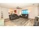 Spacious living room with hardwood floors, recessed lighting, and an open view to the kitchen at 11677 Striker Ln, Midland, NC 28107