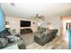 Spacious living room with gray sectional and fireplace at 11677 Striker Ln, Midland, NC 28107