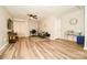Flexible living space with hardwood floors, lots of natural light, and a ceiling fan at 11677 Striker Ln, Midland, NC 28107