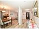 Open-concept living space with hardwood floors seamlessly connects the living and dining areas at 11677 Striker Ln, Midland, NC 28107