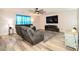 Cozy living room featuring hardwood floors, recessed lighting, and a mounted television at 11677 Striker Ln, Midland, NC 28107