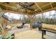 Covered patio with ceiling fan and grill at 11677 Striker Ln, Midland, NC 28107