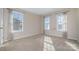 Carpeted bedroom with neutral walls and multiple windows at 12825 Franklin Square Rd # 132, Charlotte, NC 28213