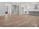 Open-concept space with hardwood floors, stairs, and a view of the kitchen at 1502 Baileys Run, Gastonia, NC 28056
