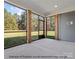 Screened in porch with wood columns overlooking the yard at 1502 Baileys Run, Gastonia, NC 28056