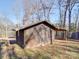 Rustic wooden shed with covered carport at 200 Little Big Horn Dr, Dallas, NC 28034